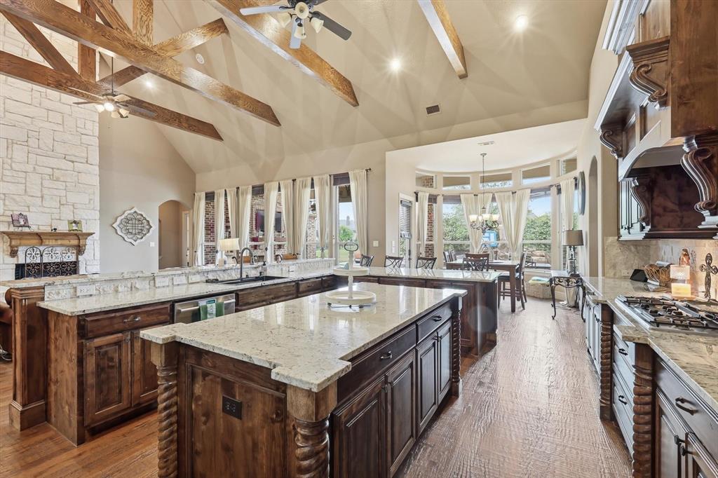 406 Spurgin Road Lucas, TX 75002 - Photo 38 of 39 a kitchen with a stove a sink dishwasher and a refrigerator with wooden floor