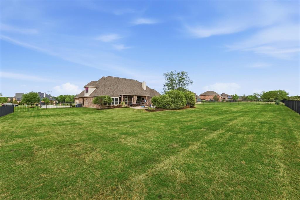 406 Spurgin Road Lucas, TX 75002 - Photo 34 of 39 a view of a house with a big yard