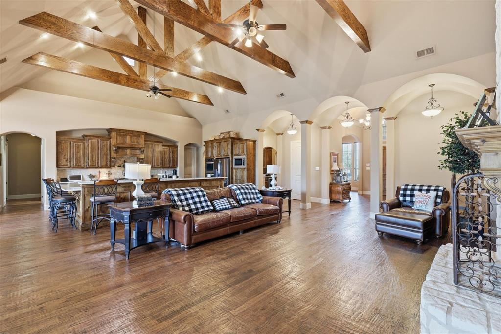 406 Spurgin Road Lucas, TX 75002 - Photo 8 of 39 a living room with lots of furniture and a chandelier