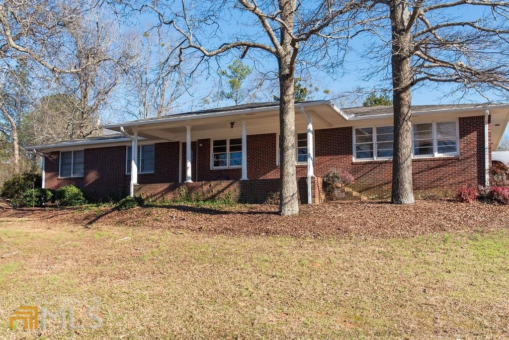 10 Clearview Drive Roopville, GA 30170 - Photo 1 of 1 a view of a house with a yard covered in snow