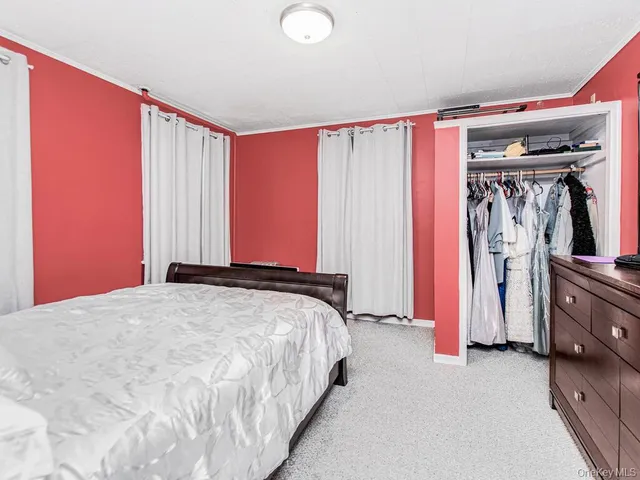 a bed room with furniture and a window