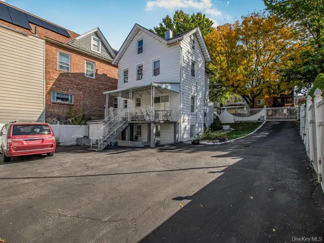 a front view of a house with parking space