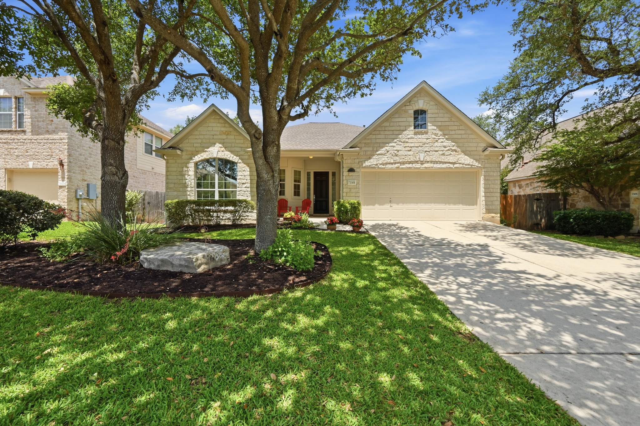 7301 Seneca Falls Loop Austin, TX 78739 - Photo 3 of 36 Welcoming curb appeal with well maintained landscaping and beautiful shade trees.