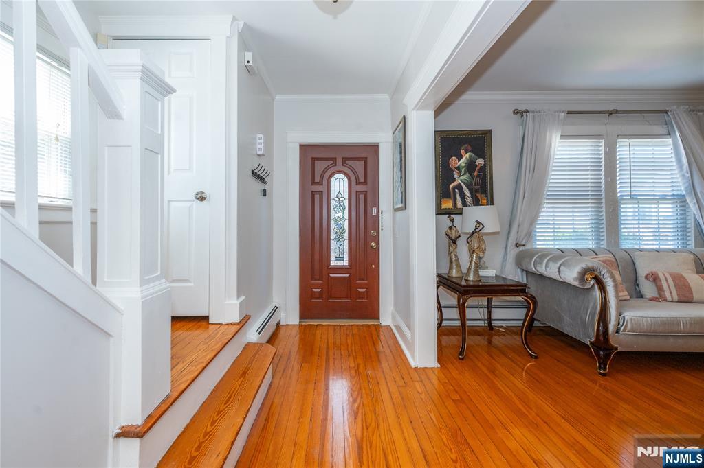 690 Garden Street Maywood, NJ 07607 - Photo 4 of 49 a living room with furniture and a wooden floor