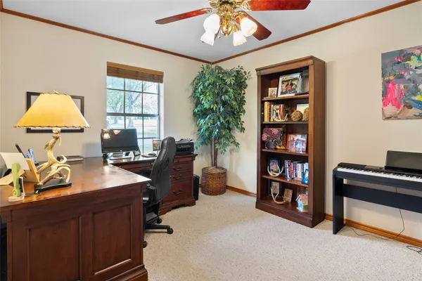 a workspace with furniture and window