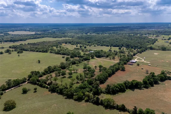 an aerial view of a houses with outdoor space