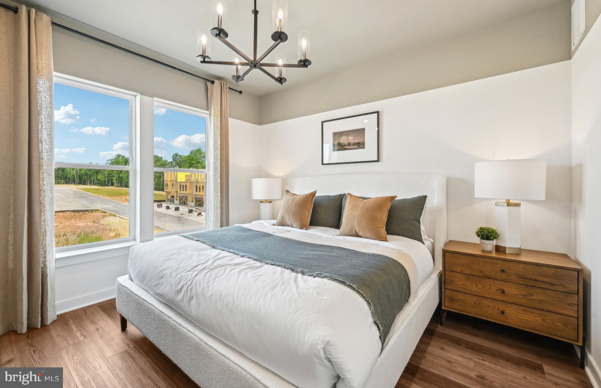 503 Crossvine Lane Laurel, MD 20724 - Photo 15 of 24 a large bed sitting in a bedroom next to a window