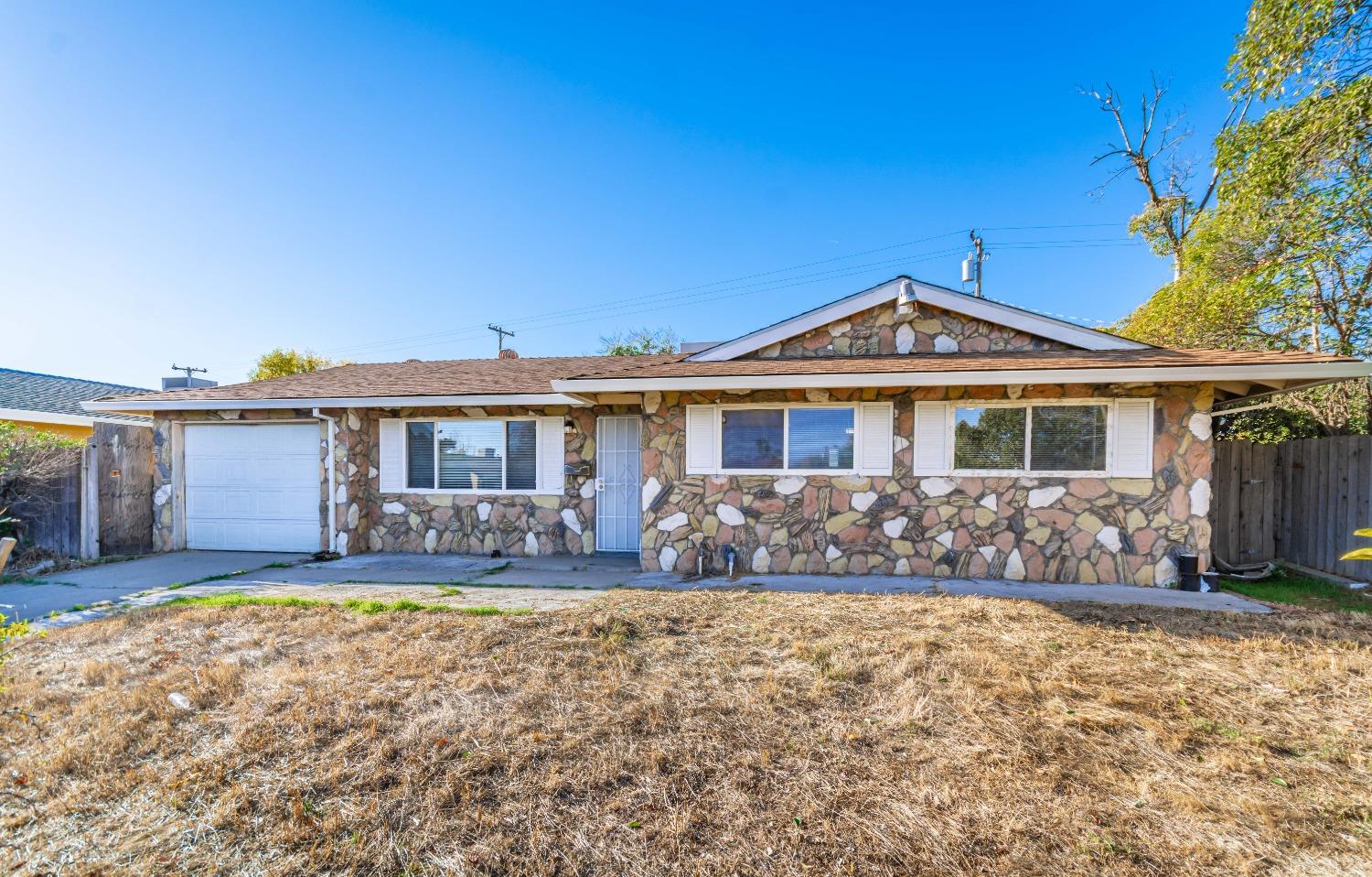 front view of a house with a yard