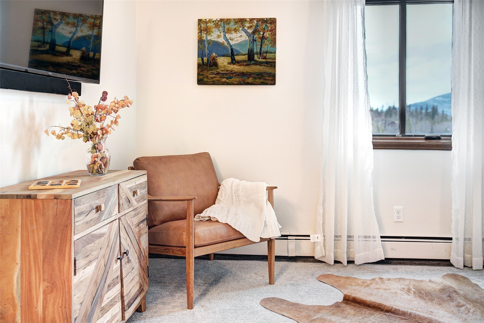 3710 Ryan Gulch Road, Unit 378 Silverthorne, CO 80498 - Photo 19 of 31 Sitting room with carpet floors and a baseboard heating unit