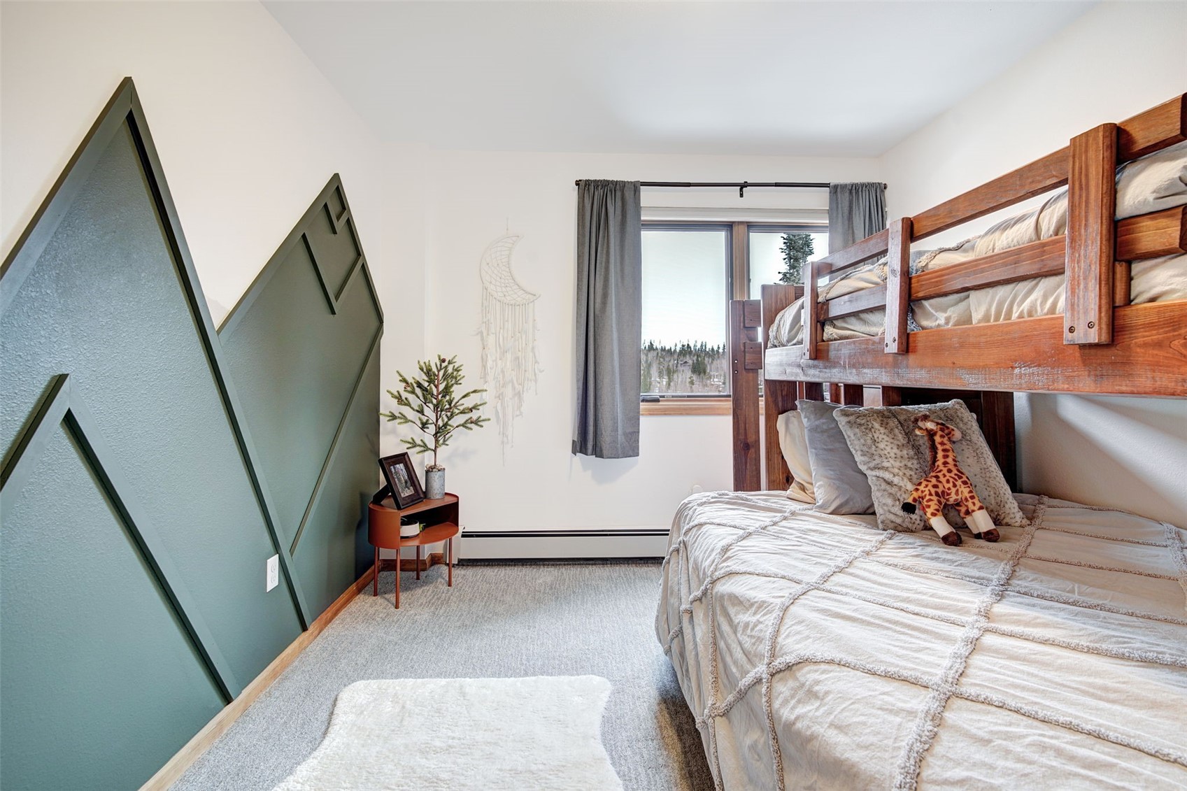 3710 Ryan Gulch Road, Unit 378 Silverthorne, CO 80498 - Photo 25 of 31 Bedroom with a baseboard heating unit and carpet