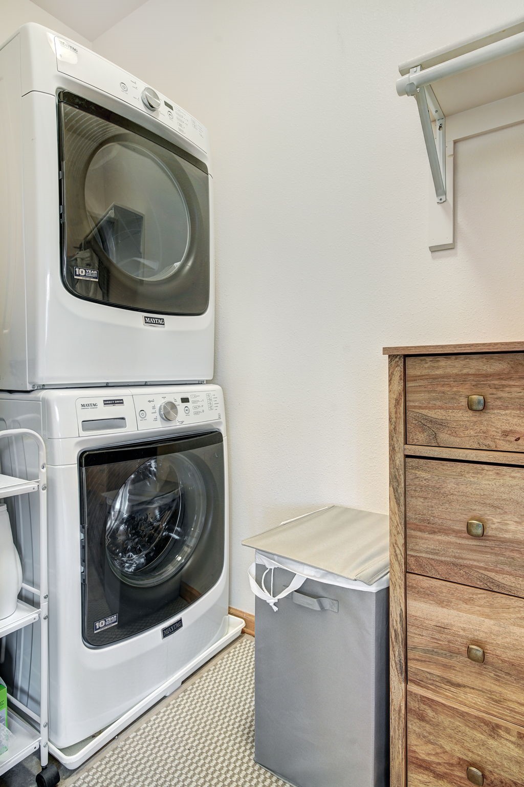 3710 Ryan Gulch Road, Unit 378 Silverthorne, CO 80498 - Photo 28 of 31 Laundry area featuring stacked washer and clothes dryer