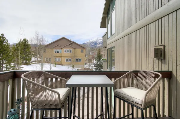 a view of a balcony with furniture