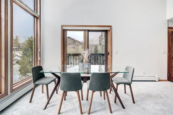 a view of a dining room with furniture window and outside view