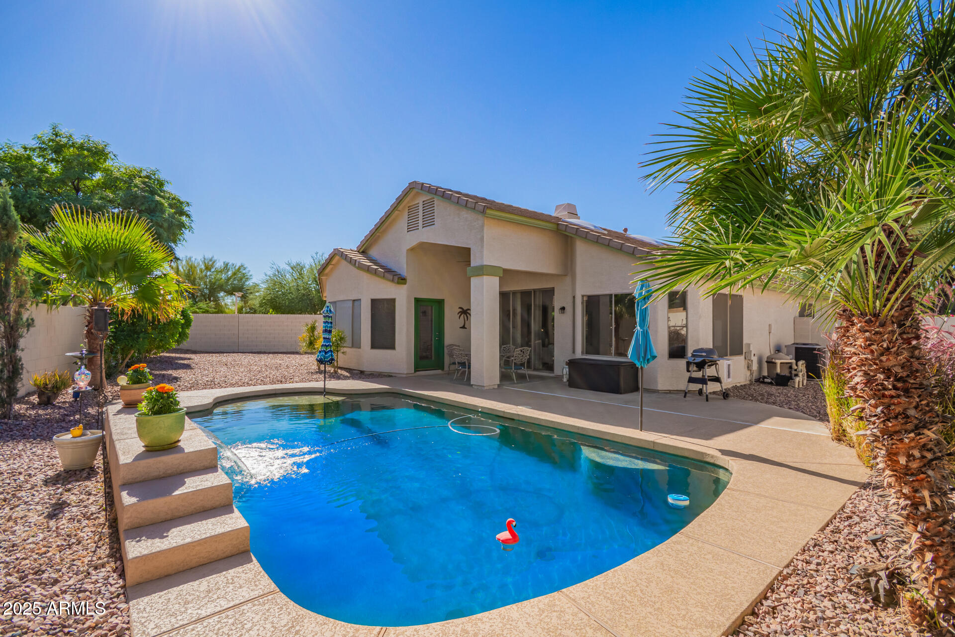 4038 West Alex Loop Phoenix, AZ 85083 - Photo 11 of 36 a view of a house with swimming pool and sitting area