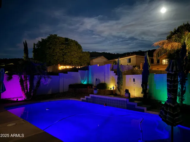 a dining room with a mirror and outdoor space