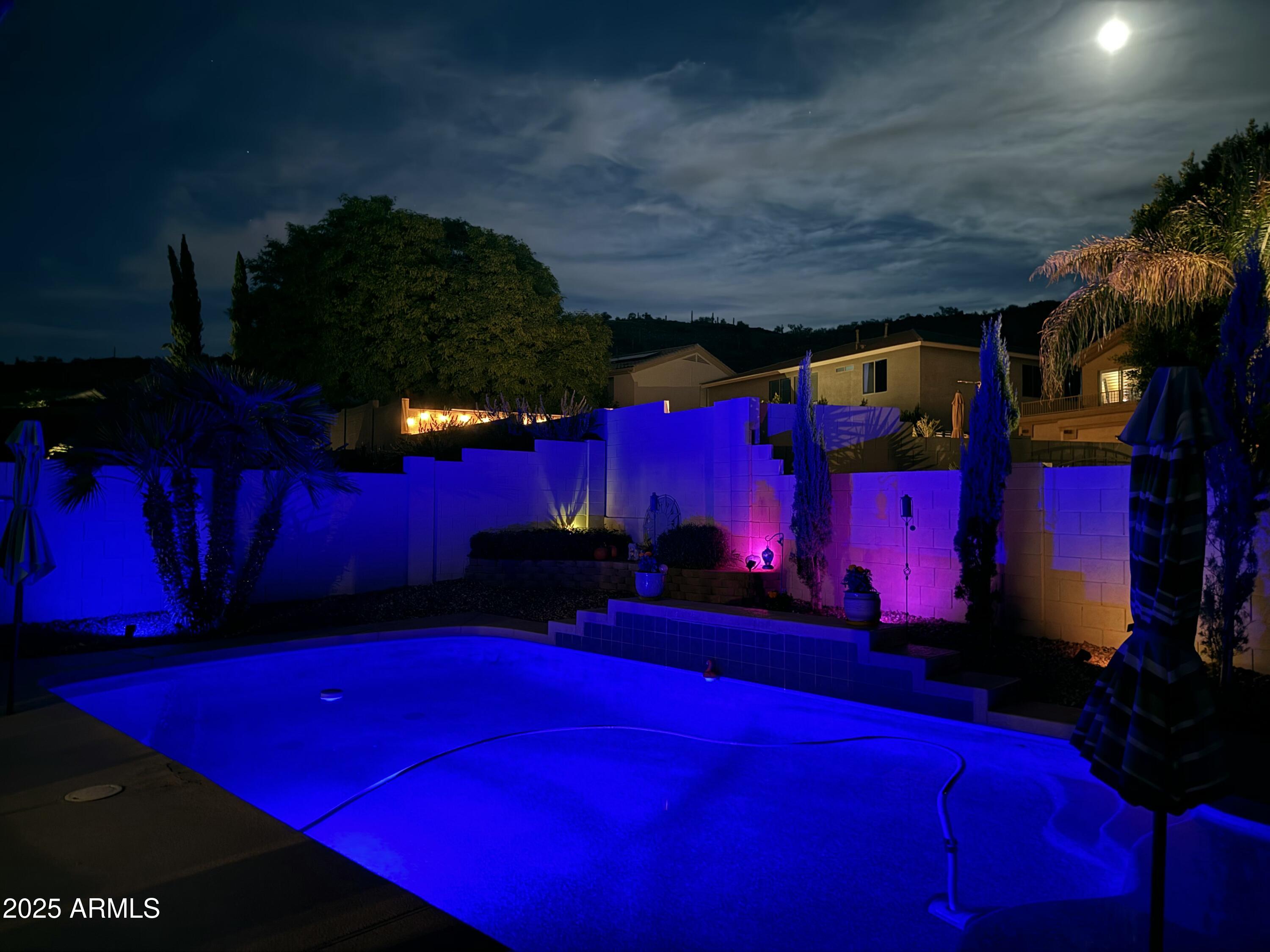 4038 West Alex Loop Phoenix, AZ 85083 - Photo 13 of 36 a view of outdoor space with seating area and trees