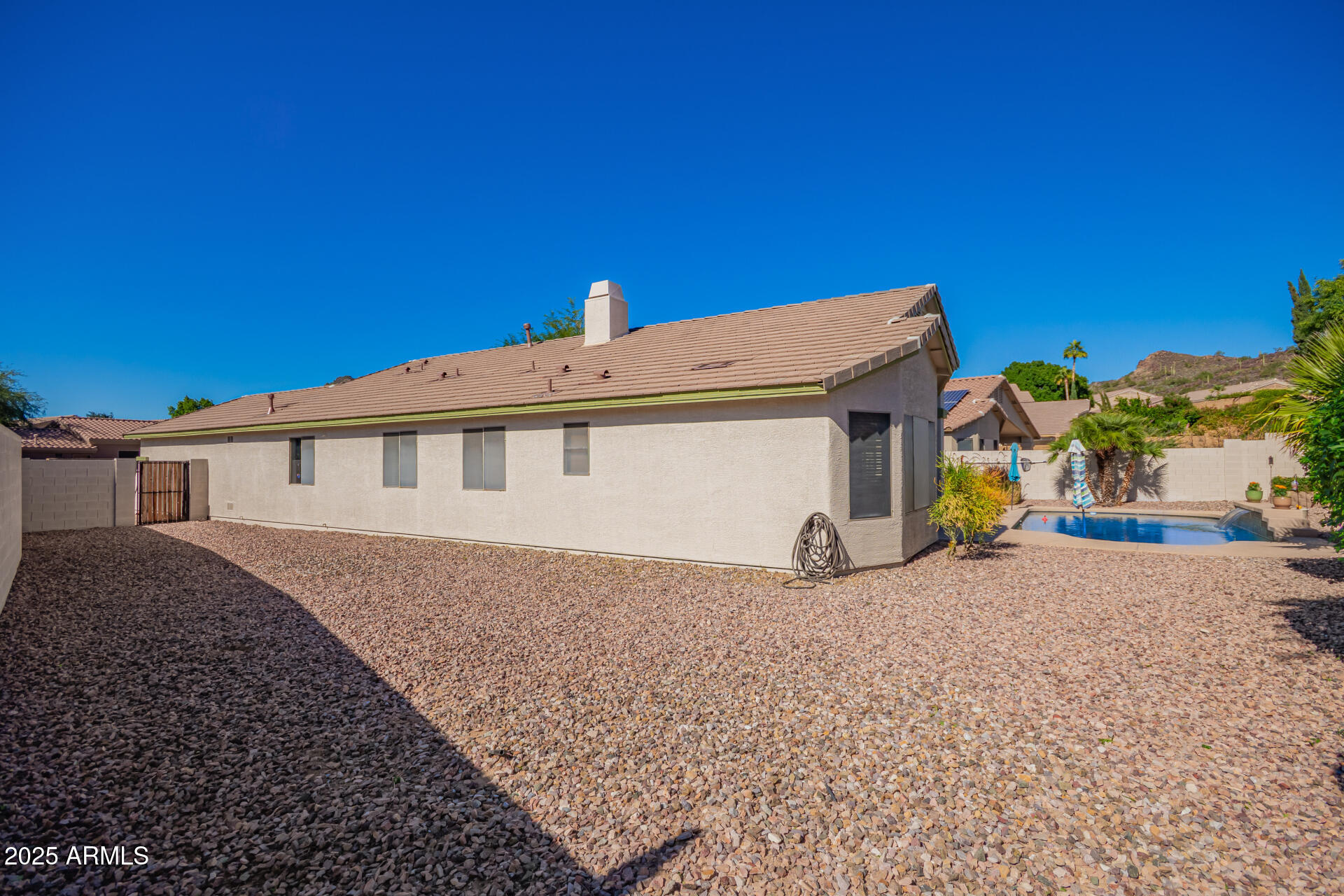 4038 West Alex Loop Phoenix, AZ 85083 - Photo 16 of 36 a view of a house with a patio