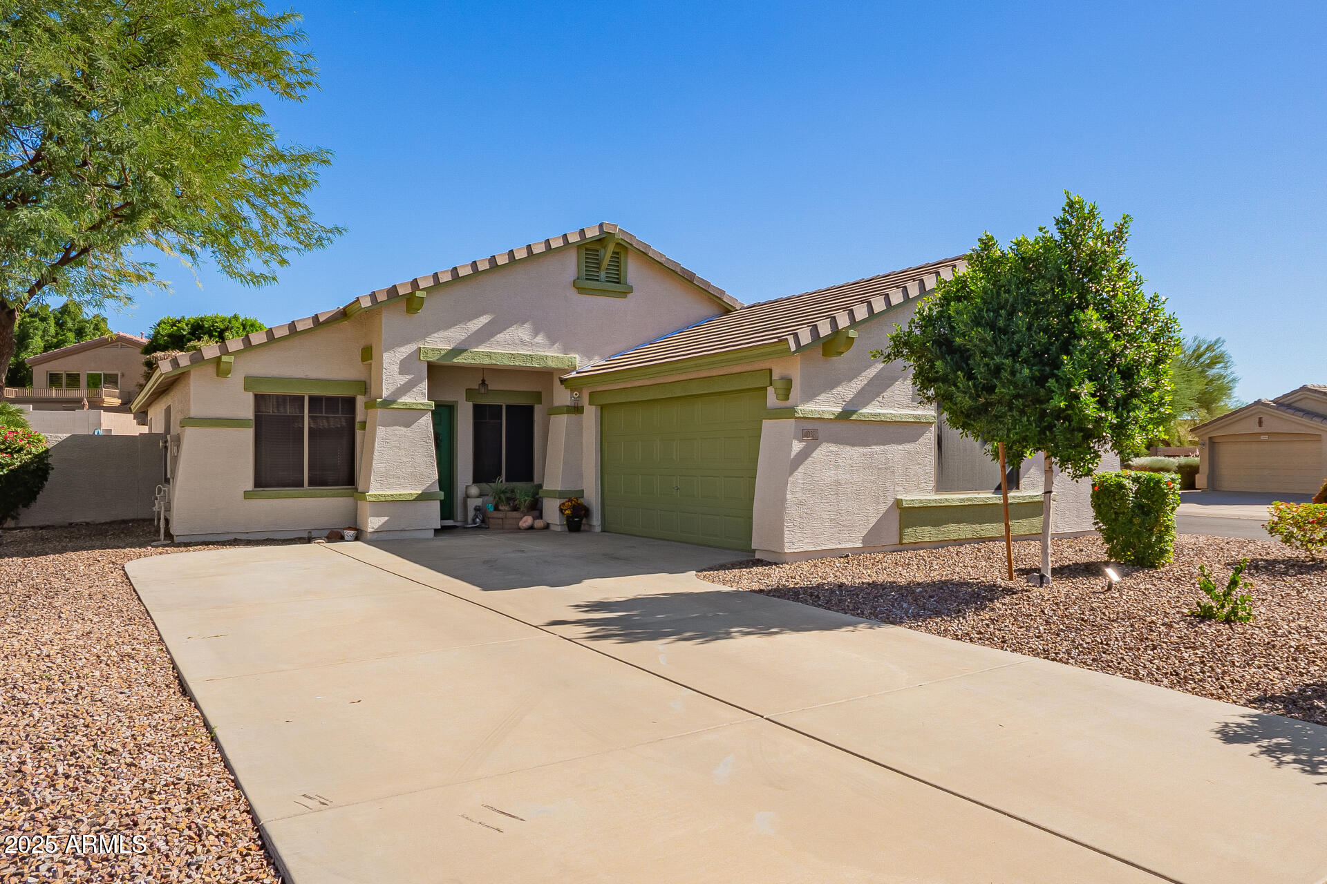 4038 West Alex Loop Phoenix, AZ 85083 - Photo 16 of 37 a front view of a house with a yard