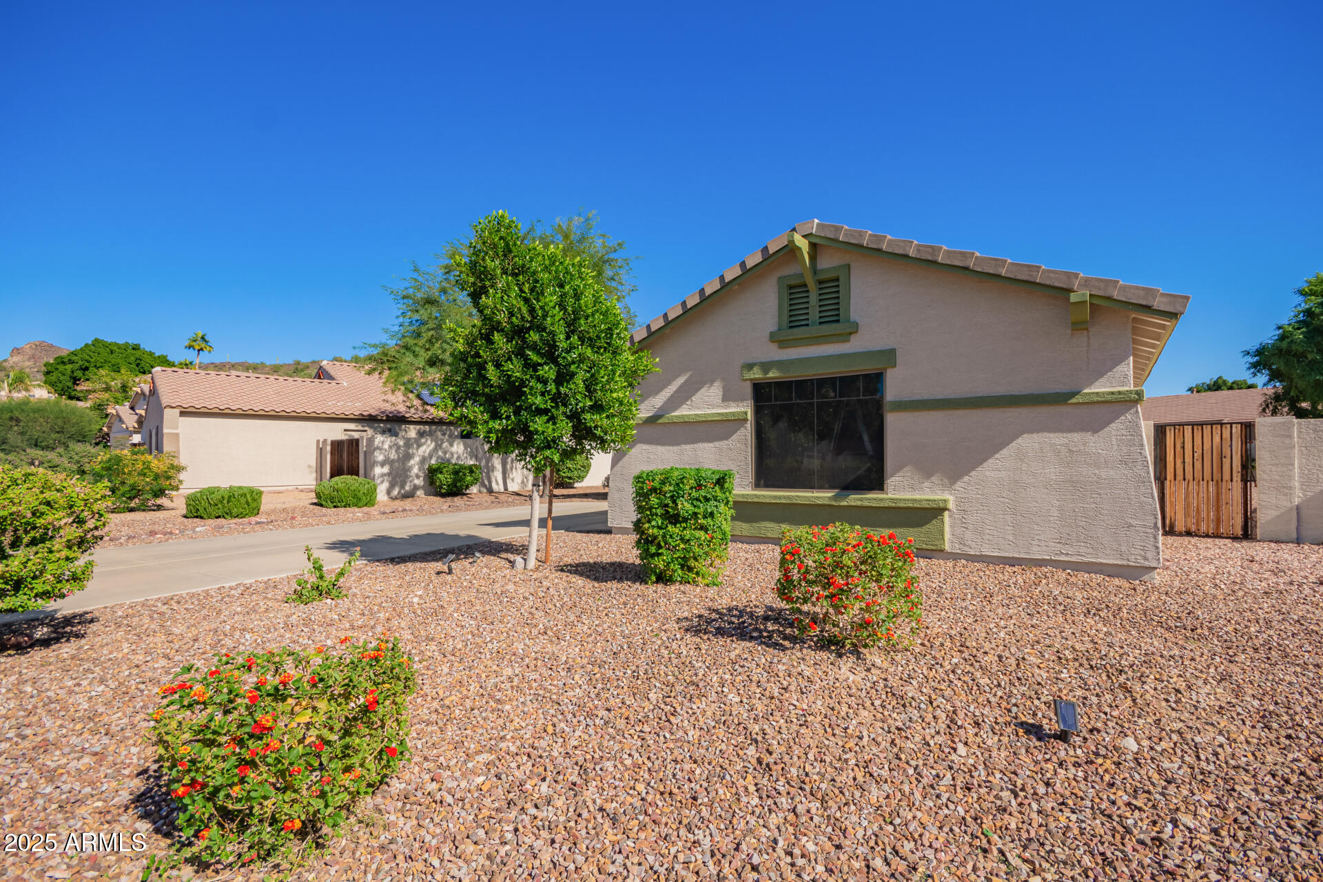 4038 West Alex Loop Phoenix, AZ 85083 - Photo 19 of 37 a front view of a house with a yard