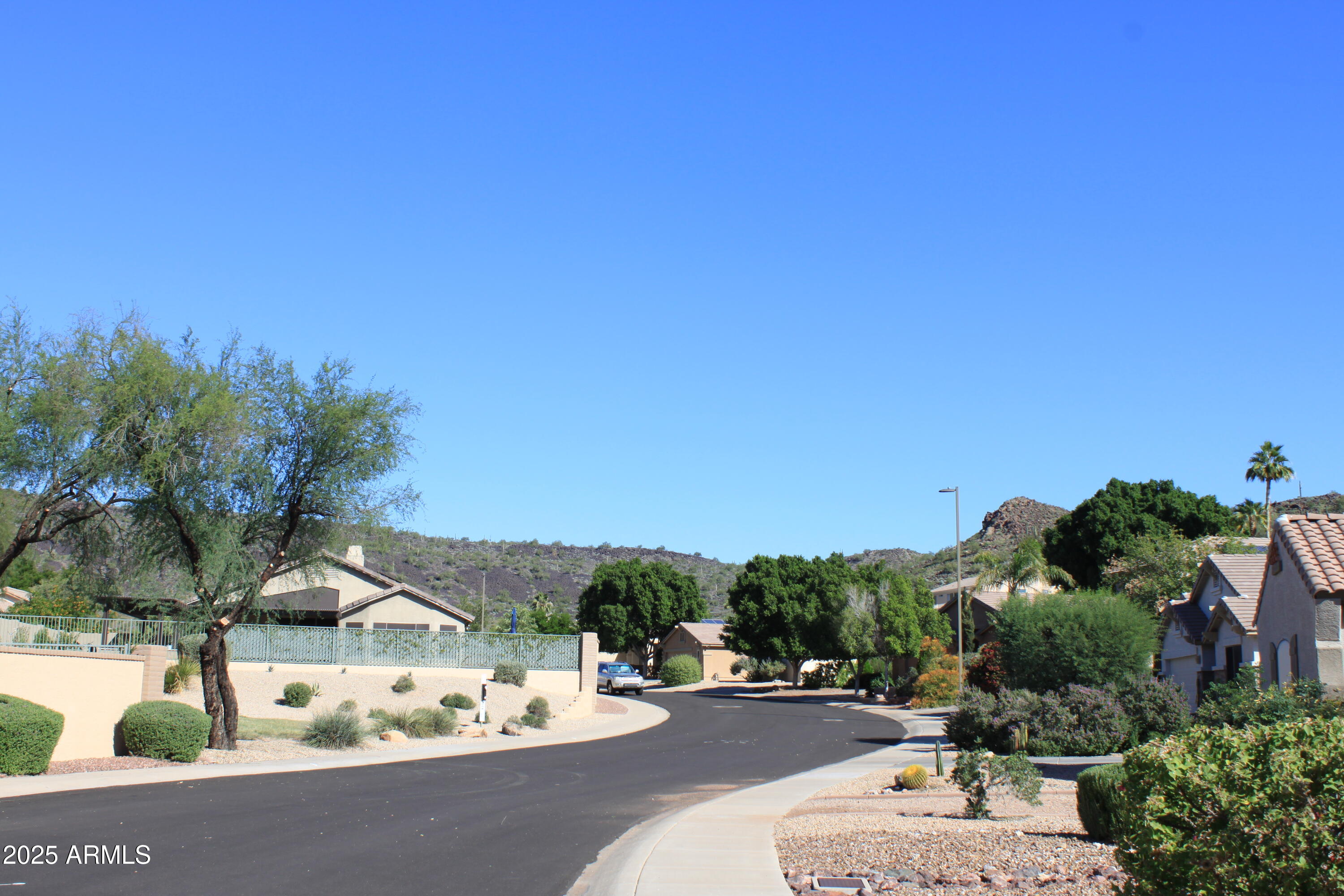 4038 West Alex Loop Phoenix, AZ 85083 - Photo 21 of 37 a view of a street with houses