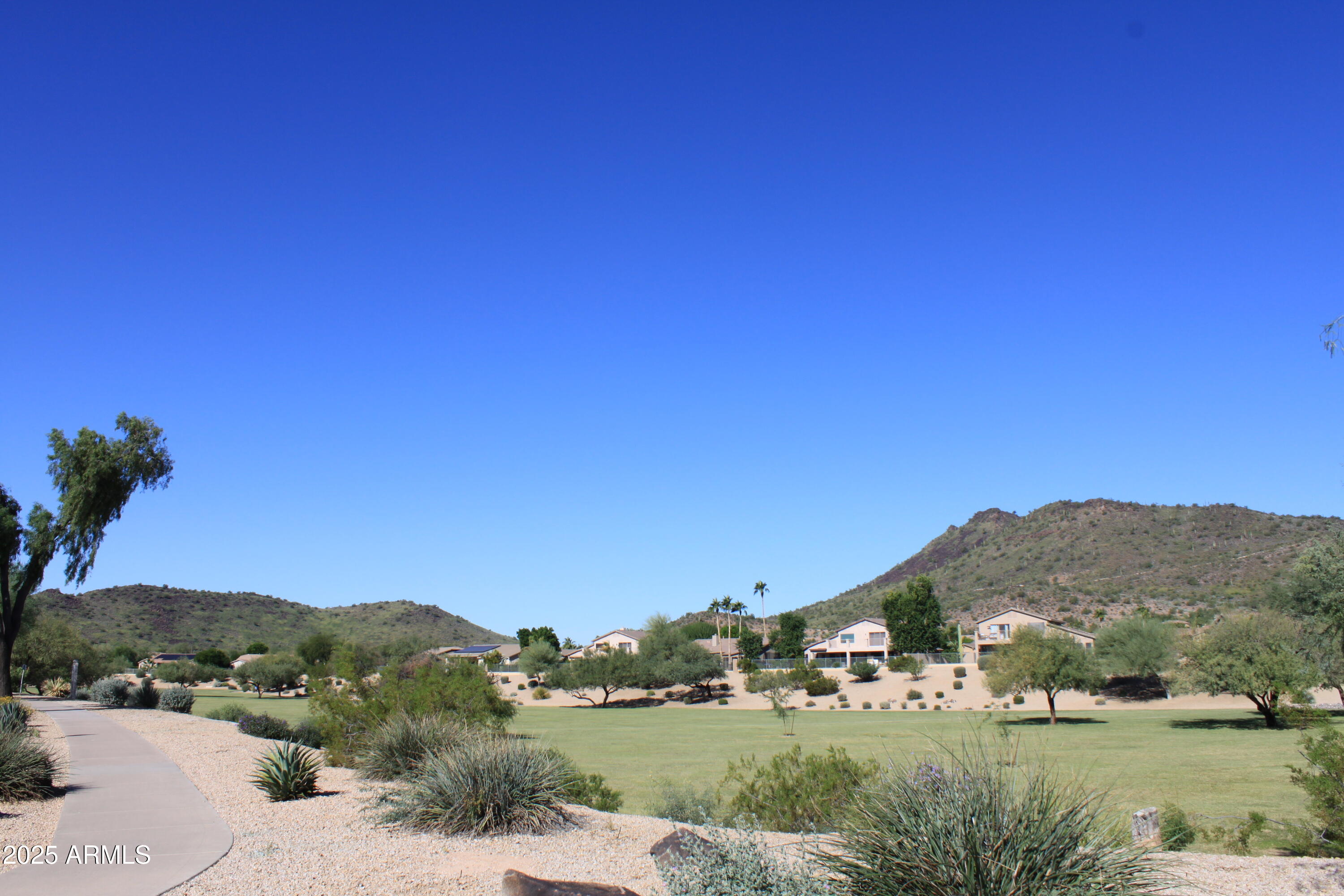 4038 West Alex Loop Phoenix, AZ 85083 - Photo 22 of 37 a view of a town with mountains in the background