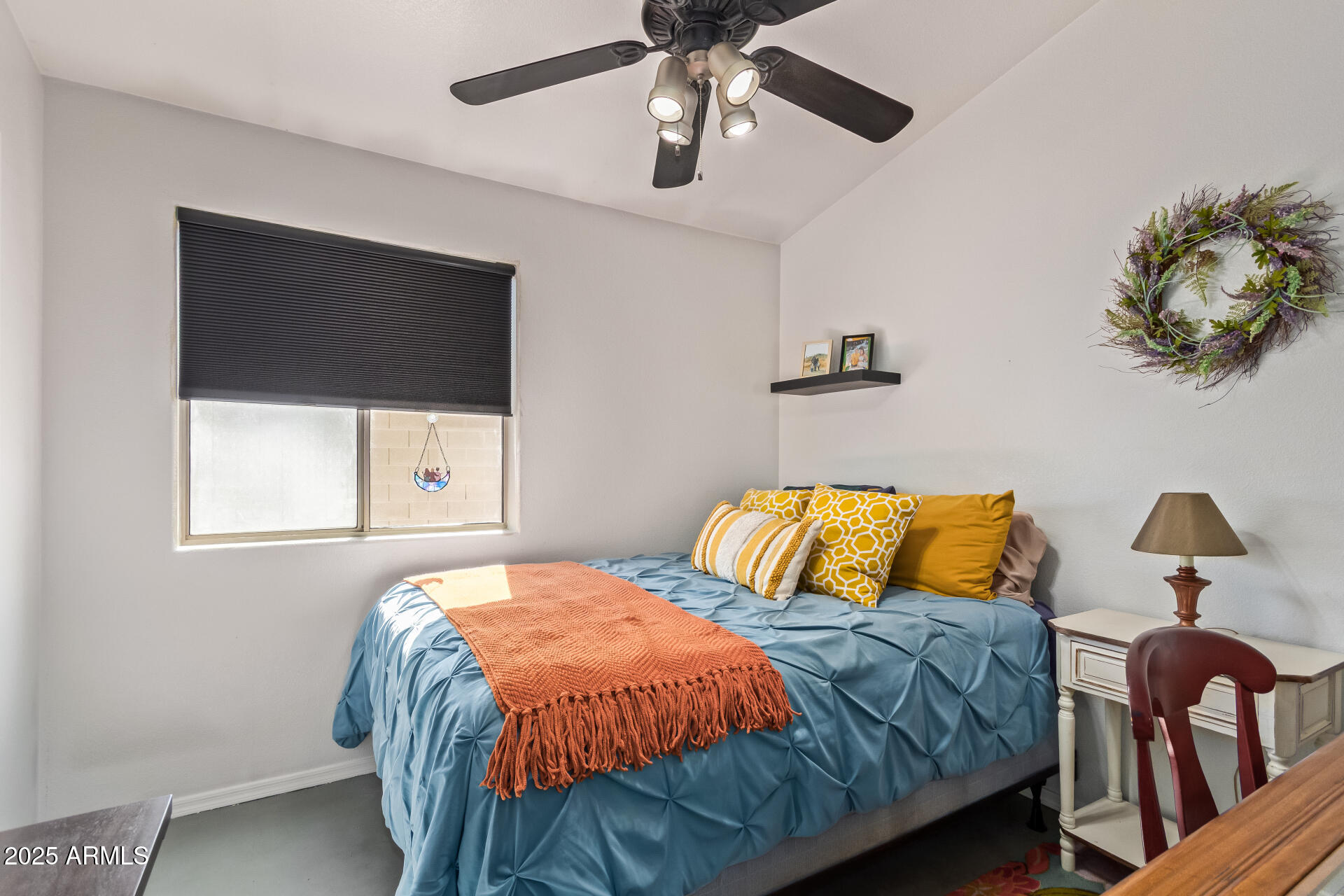 4038 West Alex Loop Phoenix, AZ 85083 - Photo 25 of 37 a bedroom with a bed and a flat tv screen