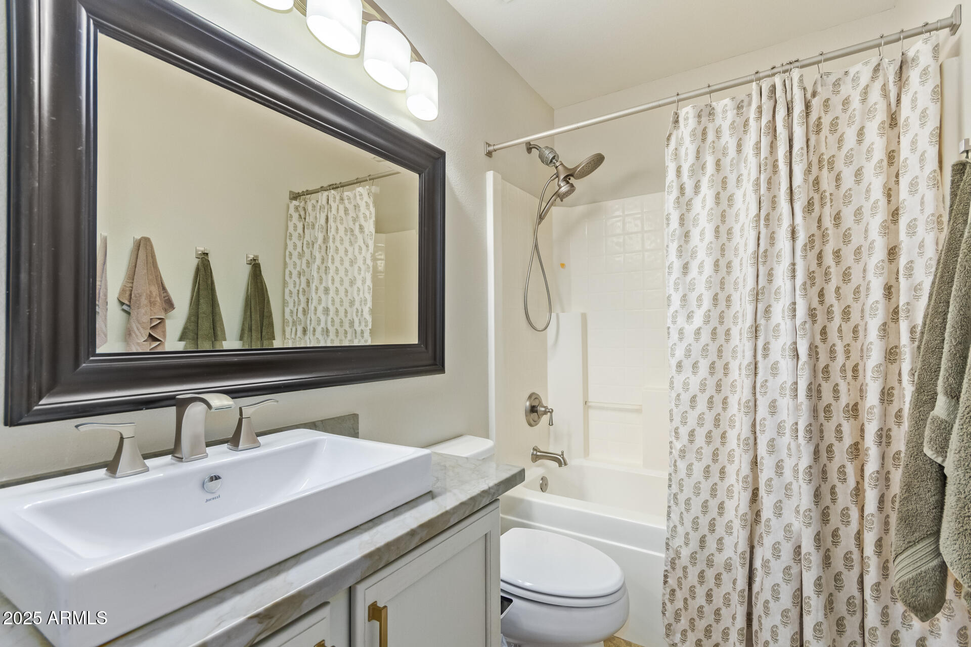 4038 West Alex Loop Phoenix, AZ 85083 - Photo 27 of 37 a bathroom with a sink a toilet and shower