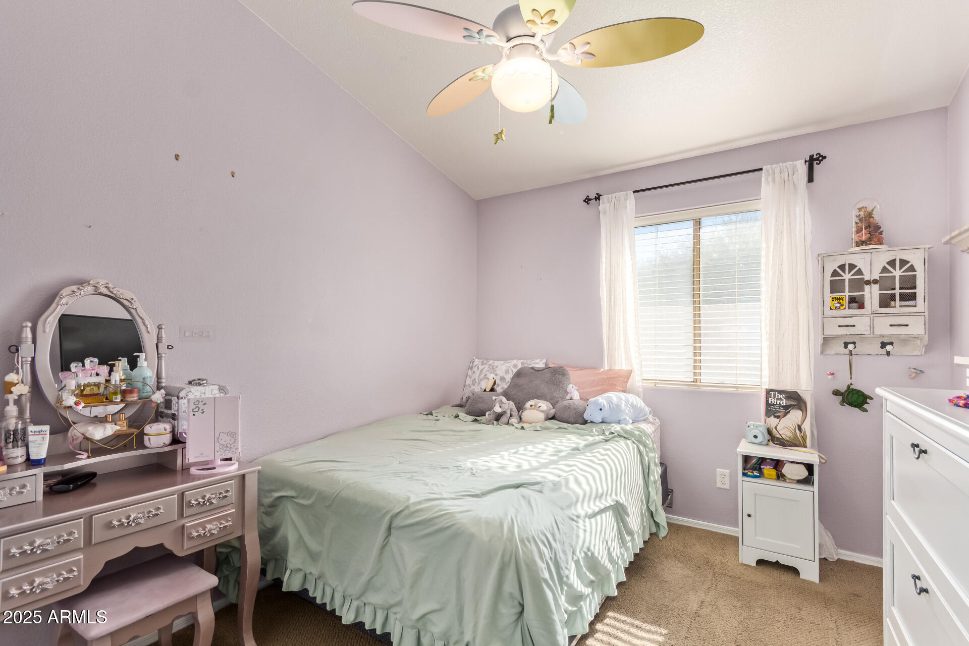 4038 West Alex Loop Phoenix, AZ 85083 - Photo 30 of 37 a bedroom with a bed and a chandelier