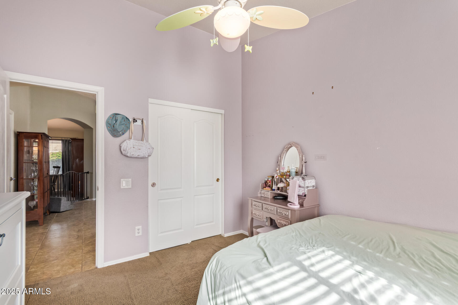 4038 West Alex Loop Phoenix, AZ 85083 - Photo 31 of 37 a bedroom with a bed and a chandelier