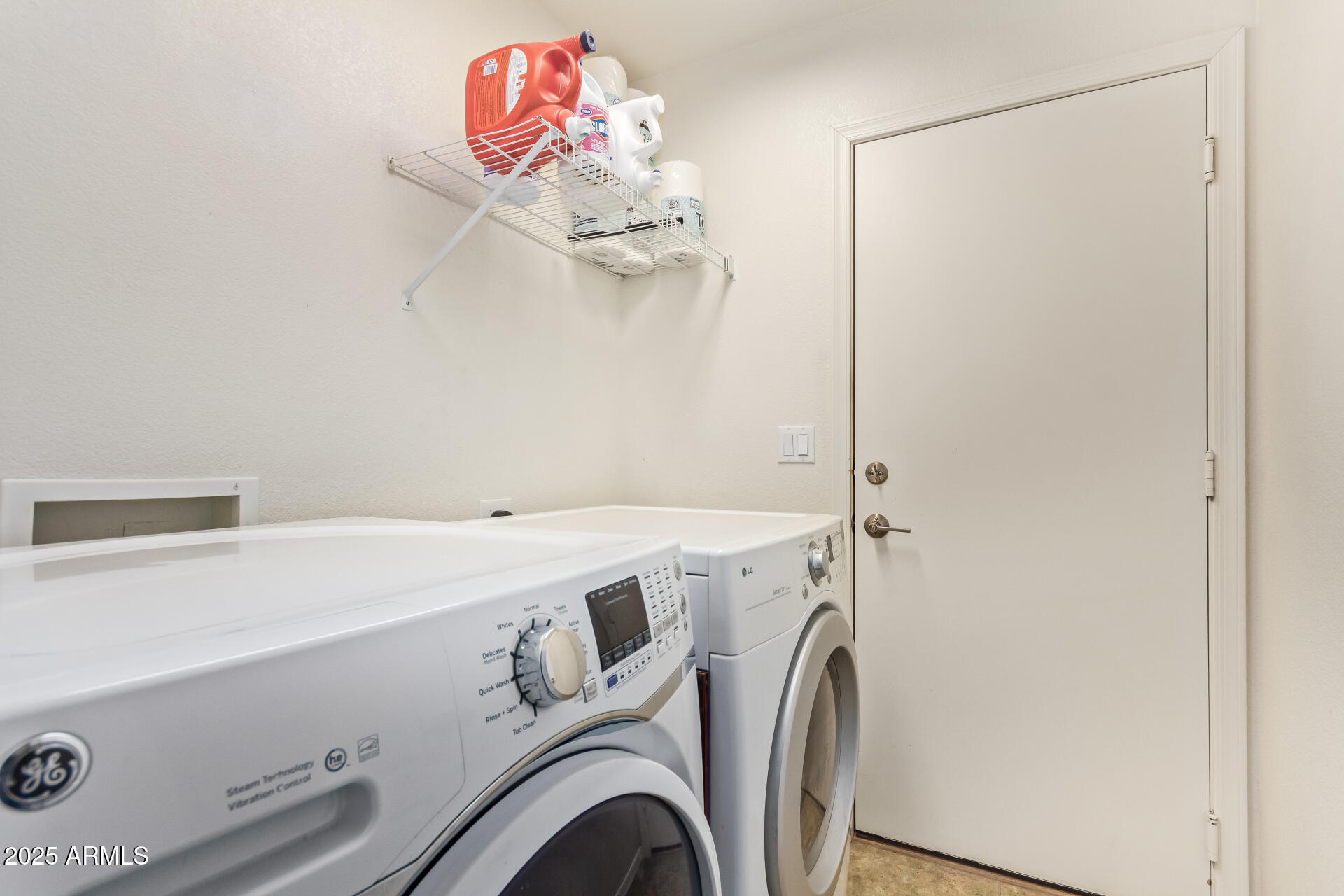 4038 West Alex Loop Phoenix, AZ 85083 - Photo 32 of 37 a utility room with dryer and washer