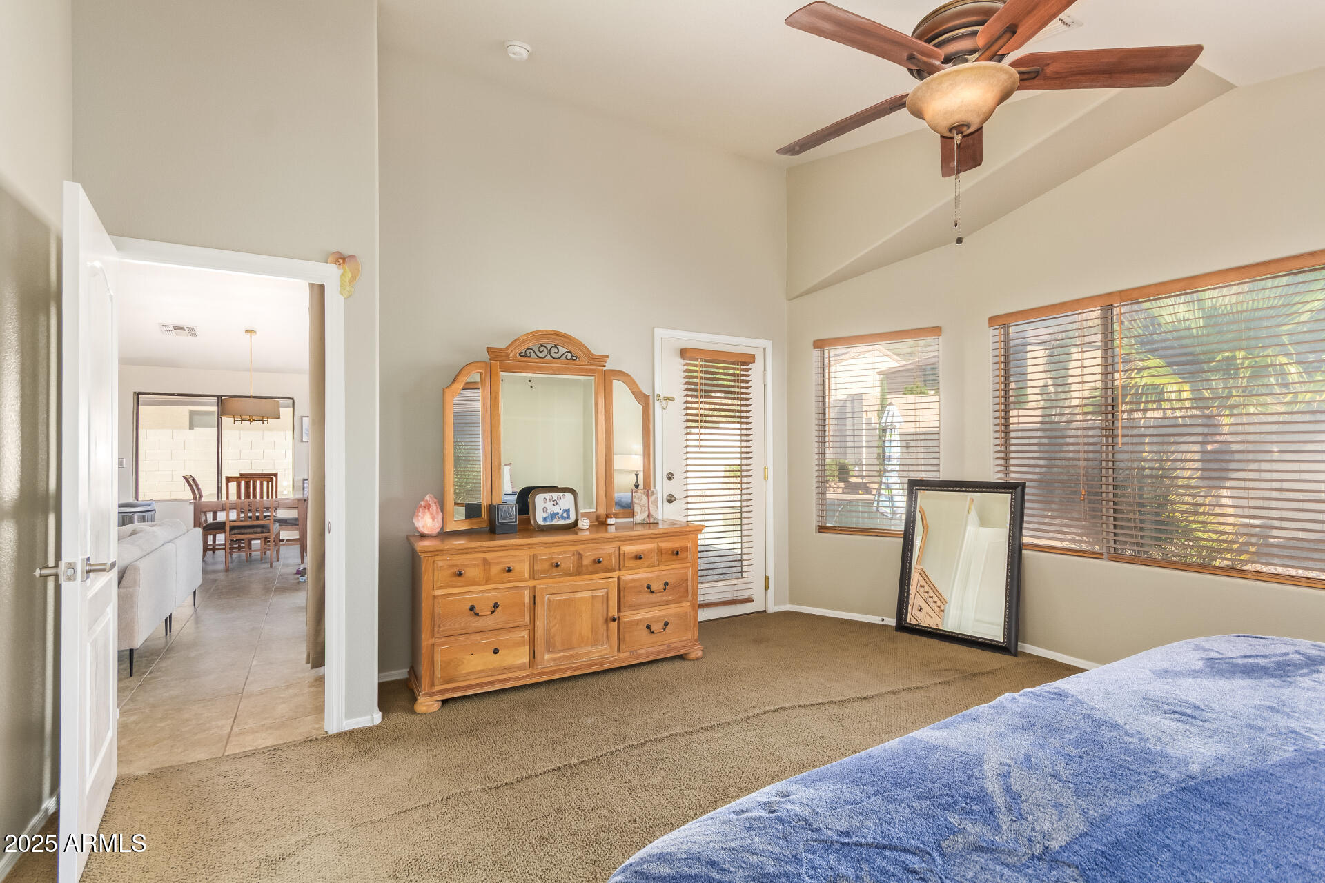 4038 West Alex Loop Phoenix, AZ 85083 - Photo 34 of 37 a large bedroom with a large bed and glass door