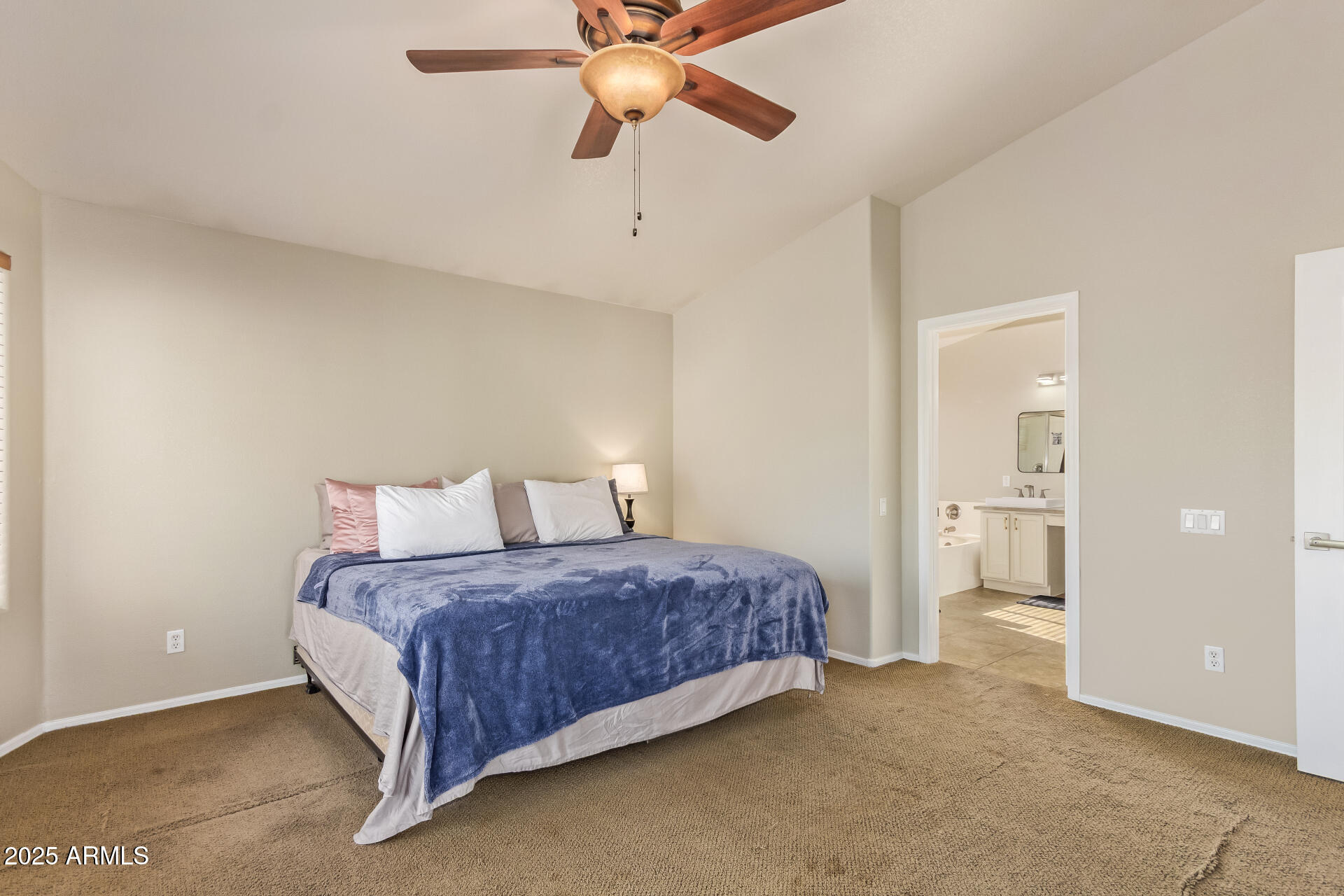 4038 West Alex Loop Phoenix, AZ 85083 - Photo 35 of 37 a bedroom with a bed and a chandelier