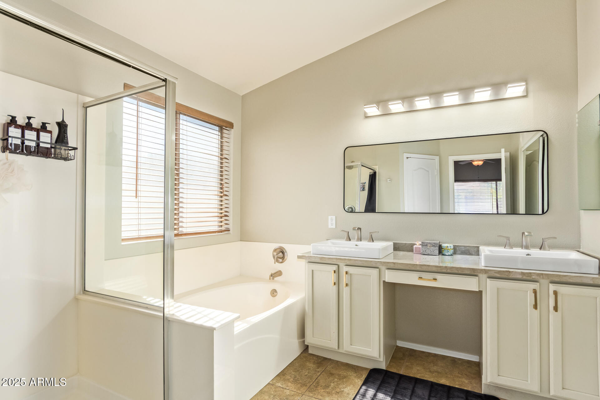 4038 West Alex Loop Phoenix, AZ 85083 - Photo 36 of 37 a bathroom with a double vanity sink a mirror and a bathtub
