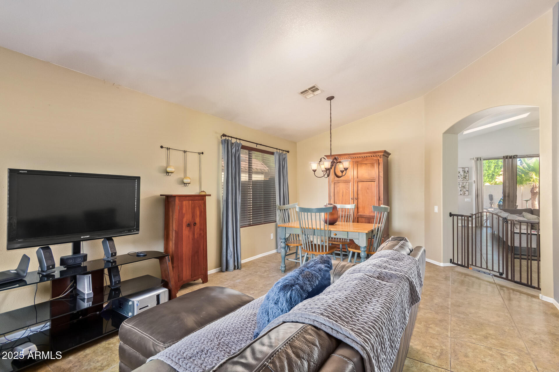 4038 West Alex Loop Phoenix, AZ 85083 - Photo 37 of 37 a living room with furniture and a flat screen tv