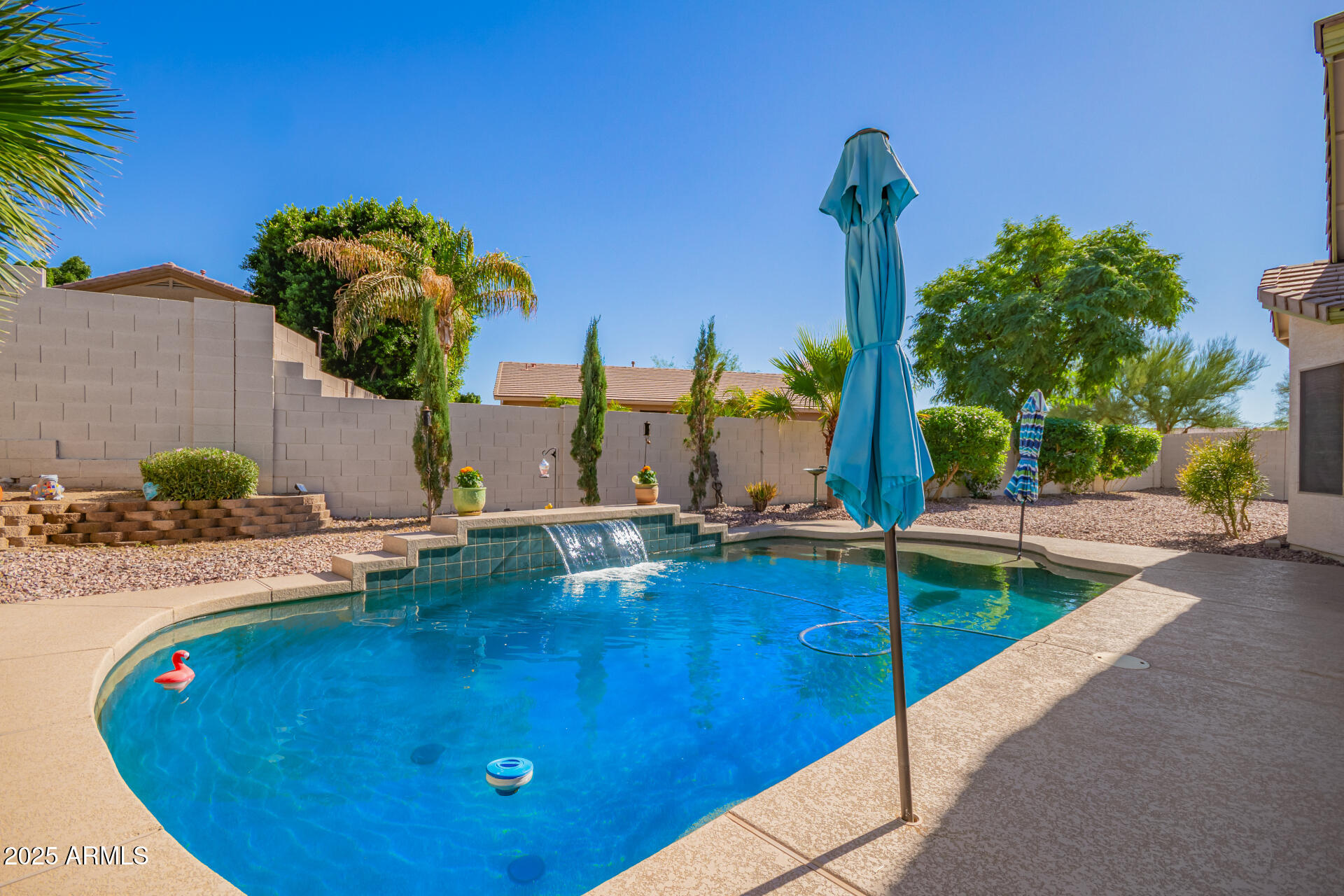 4038 West Alex Loop Phoenix, AZ 85083 - Photo 9 of 37 a view of a swimming pool with a lounge chairs