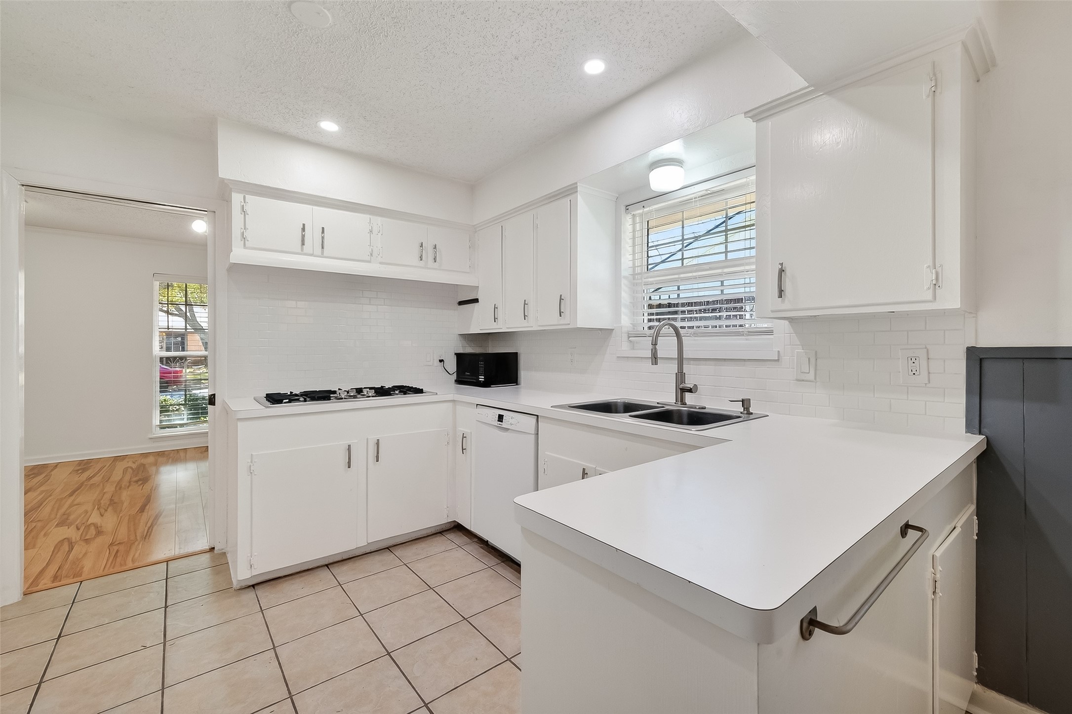 7014 Concho Street Houston, TX 77074 - Photo 17 of 46 This kitchen is so functional with plenty of cabinets, abundant counter space, double sinks and recent dishwasher (2023) and oven (2025).