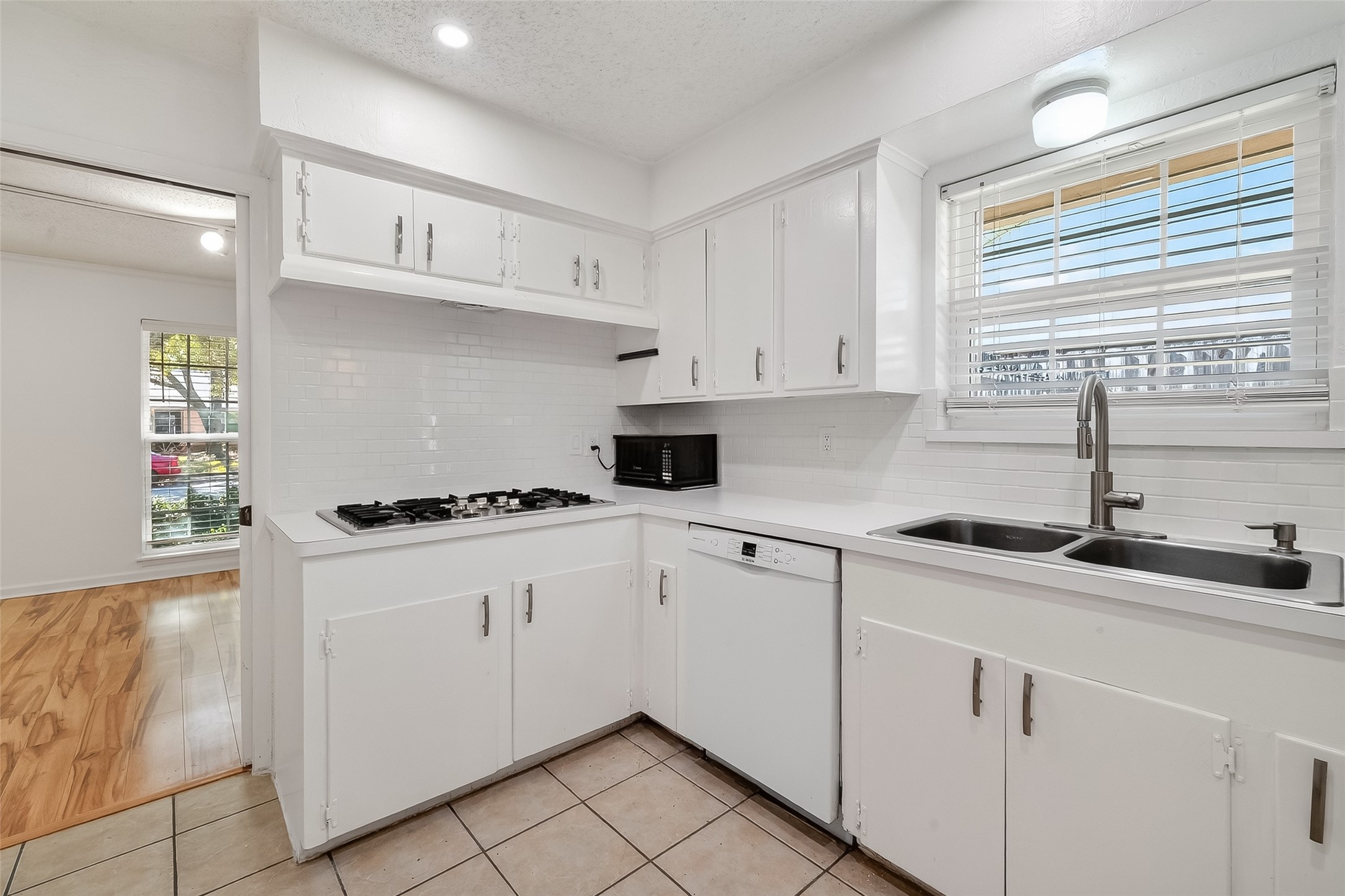7014 Concho Street Houston, TX 77074 - Photo 19 of 46 White subway tile backsplash gives this kitchen a clean fresh feel.