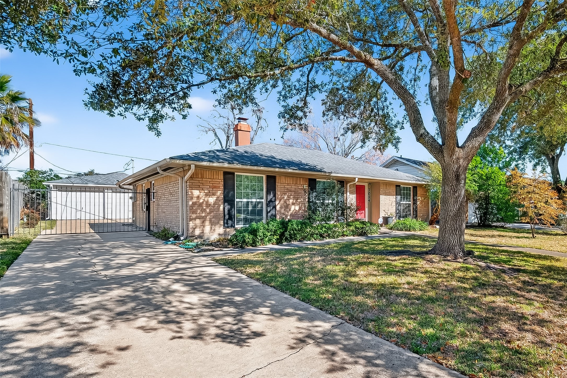 7014 Concho Street Houston, TX 77074 - Photo 3 of 46 There is an iron gate - not electric.