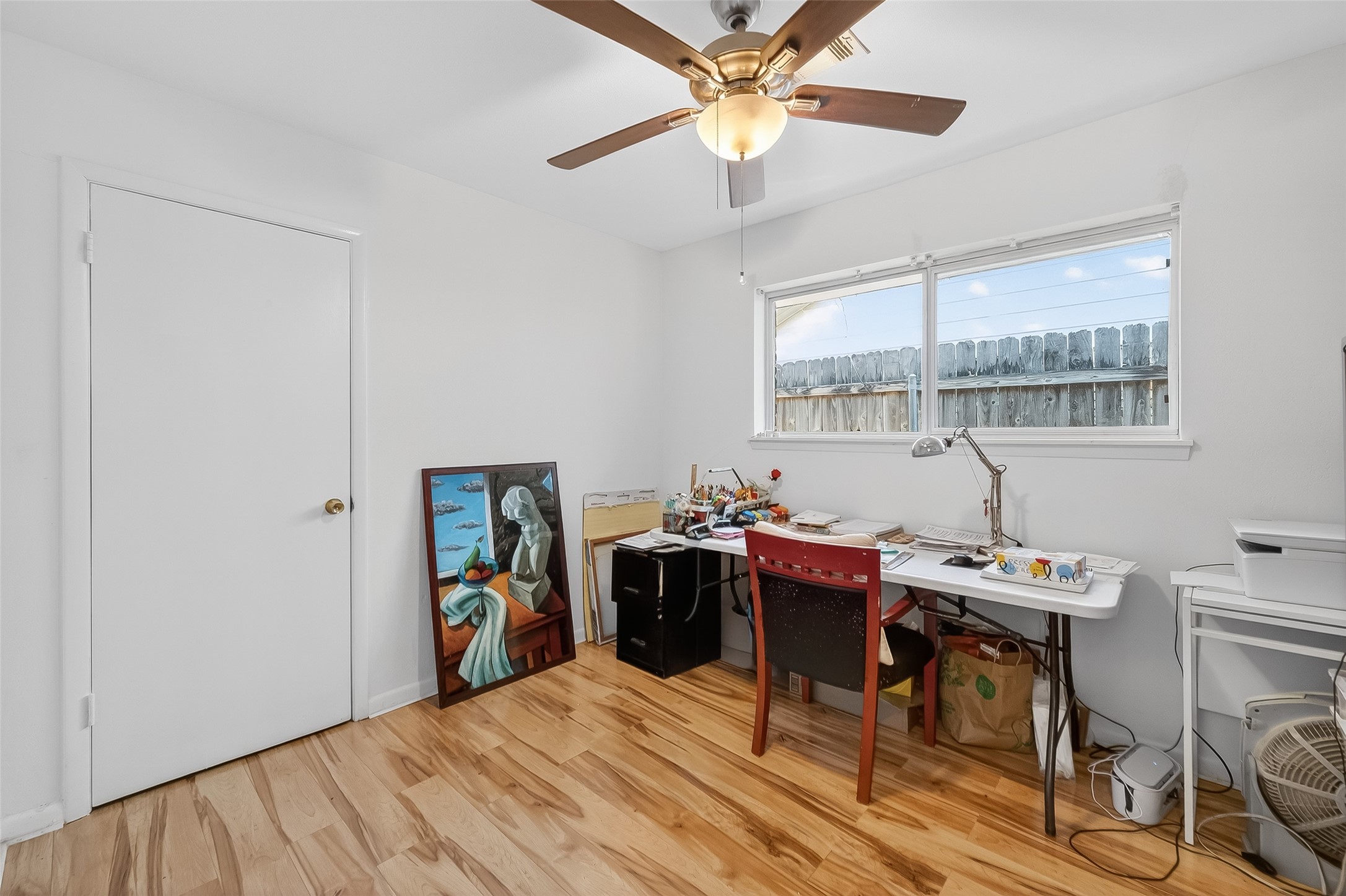 7014 Concho Street Houston, TX 77074 - Photo 34 of 46 This secondary bedroom also has a large window, laminate floor and a ceiling fan.