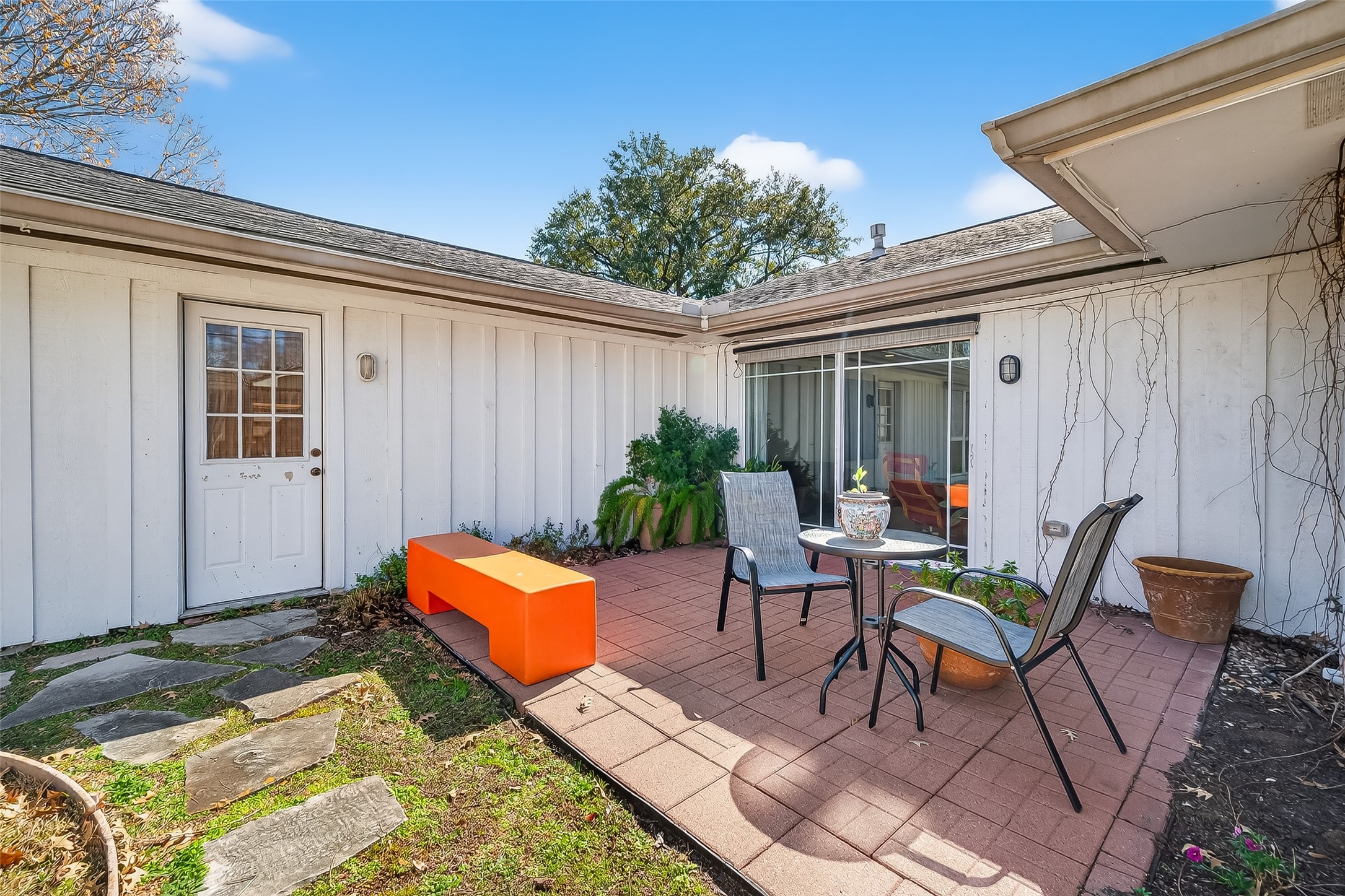 7014 Concho Street Houston, TX 77074 - Photo 40 of 46 There is a patio. The door leads to one of the bedrooms. The sliding door leads to the family room.