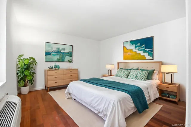 a view of a hallway with wooden cabinets