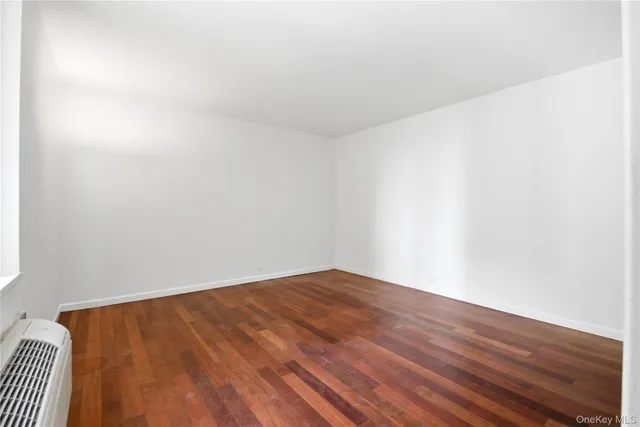 a room with furniture and wooden floor