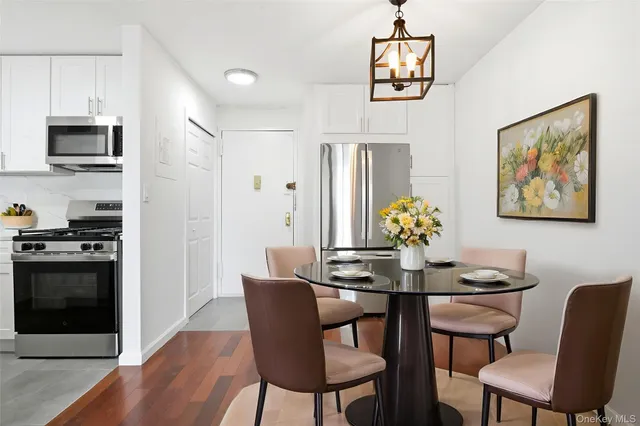 a dining room with furniture and window