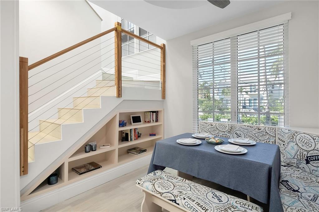 1160 Clam Court, Unit 3 Naples, FL 34102 - Photo 12 of 50 a view of a dining room with furniture window and outside view