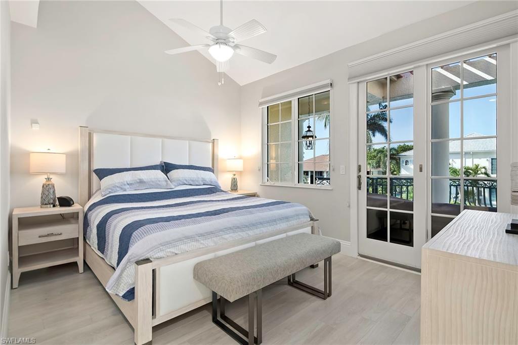 1160 Clam Court, Unit 3 Naples, FL 34102 - Photo 15 of 50 a spacious bedroom with a bed and a window