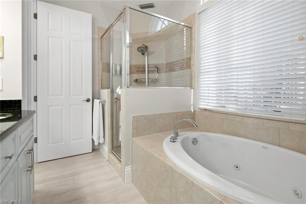 1160 Clam Court, Unit 3 Naples, FL 34102 - Photo 20 of 50 a bathroom with a bathtub and shower