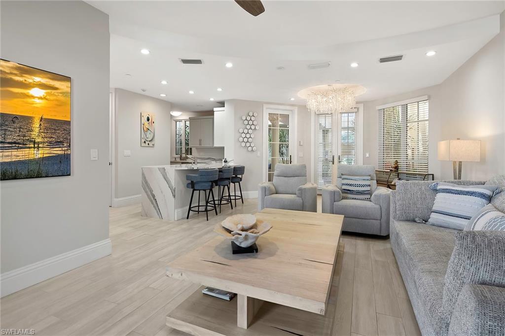 1160 Clam Court, Unit 3 Naples, FL 34102 - Photo 25 of 50 a living room with furniture and a flat screen tv