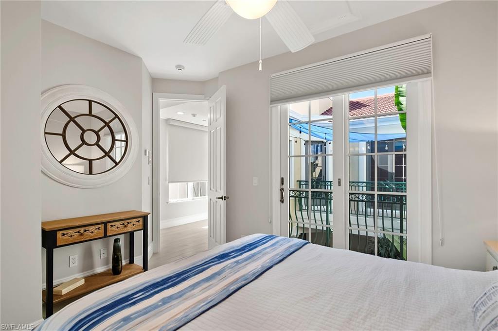 1160 Clam Court, Unit 3 Naples, FL 34102 - Photo 33 of 50 a bedroom with a bed and a window