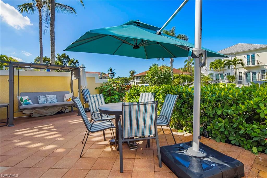 1160 Clam Court, Unit 3 Naples, FL 34102 - Photo 44 of 50 a view of a backyard with sitting area