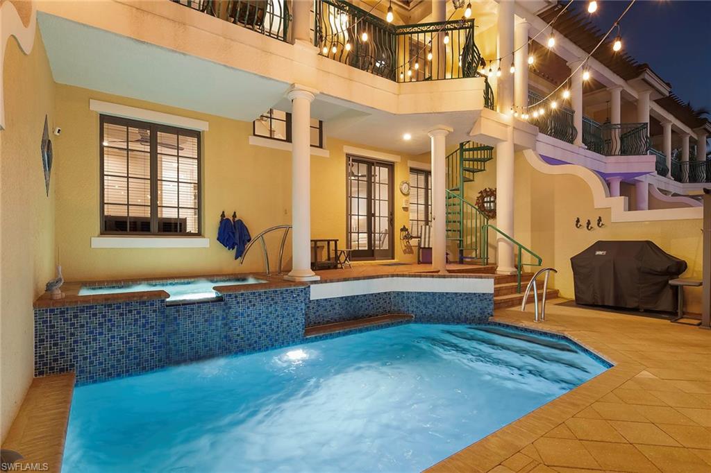 1160 Clam Court, Unit 3 Naples, FL 34102 - Photo 47 of 50 a living room with fireplace furniture and a window